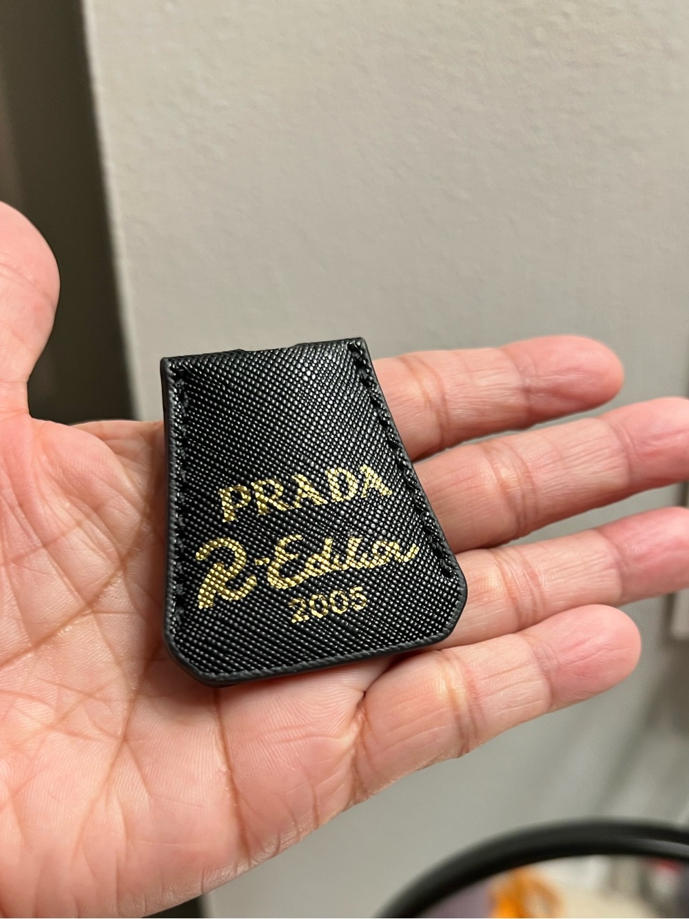 Prada Black Leather tag and  Gold Logo